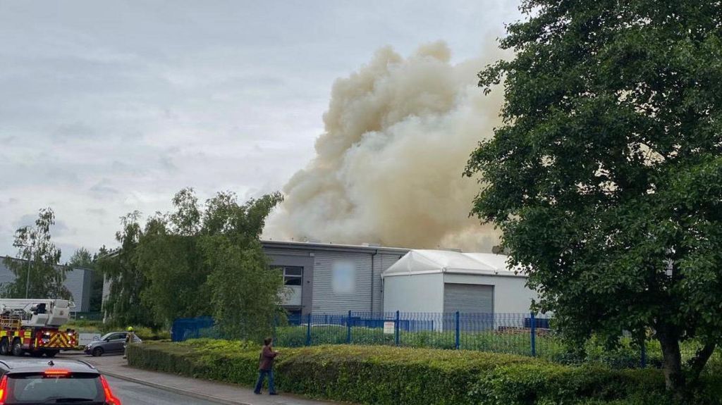 Smoke billowing out from the industrial unit
