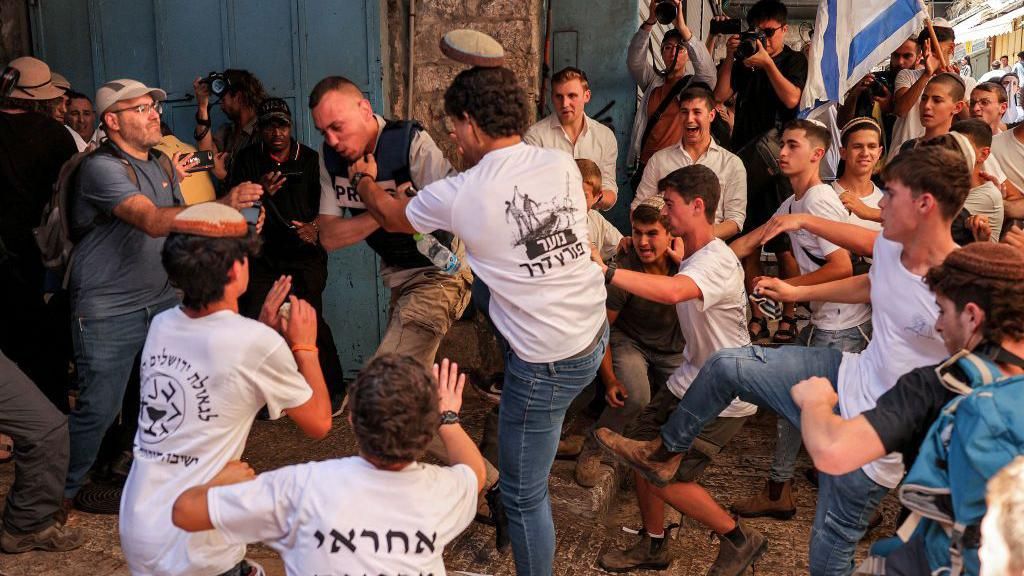 Palestinian journalist Saif Kwasmi was kicked and punched by young Israeli men in Jerusalem's Old City, in occupied East Jerusalem (5 June 2024)