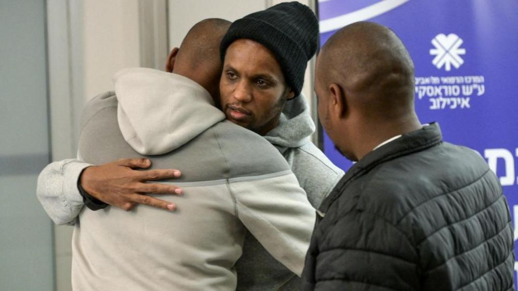 Image shows Avera Mengistu, who entered Gaza around a decade ago and had been held there since, hugging his family members after being released as part of hostages-prisoners swap on February 22, 2025