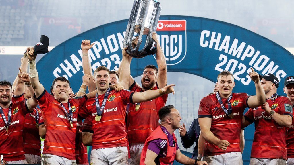 Munster players celebrate with the United Rugby Championship title
