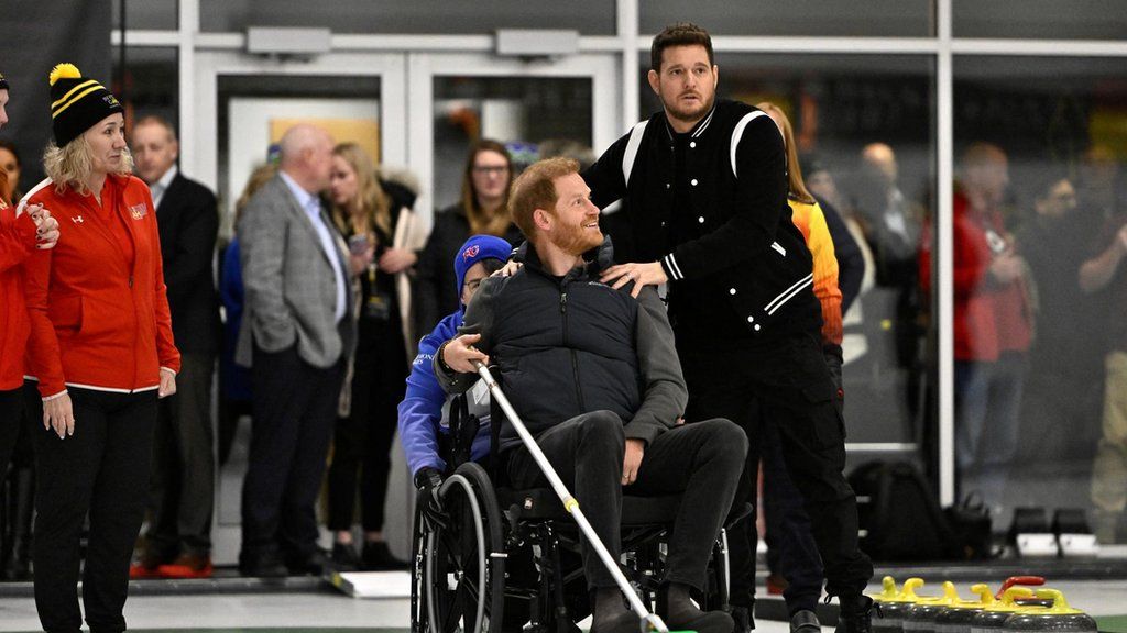 Prince Harry playing wheelchair curling with Michael Bublé