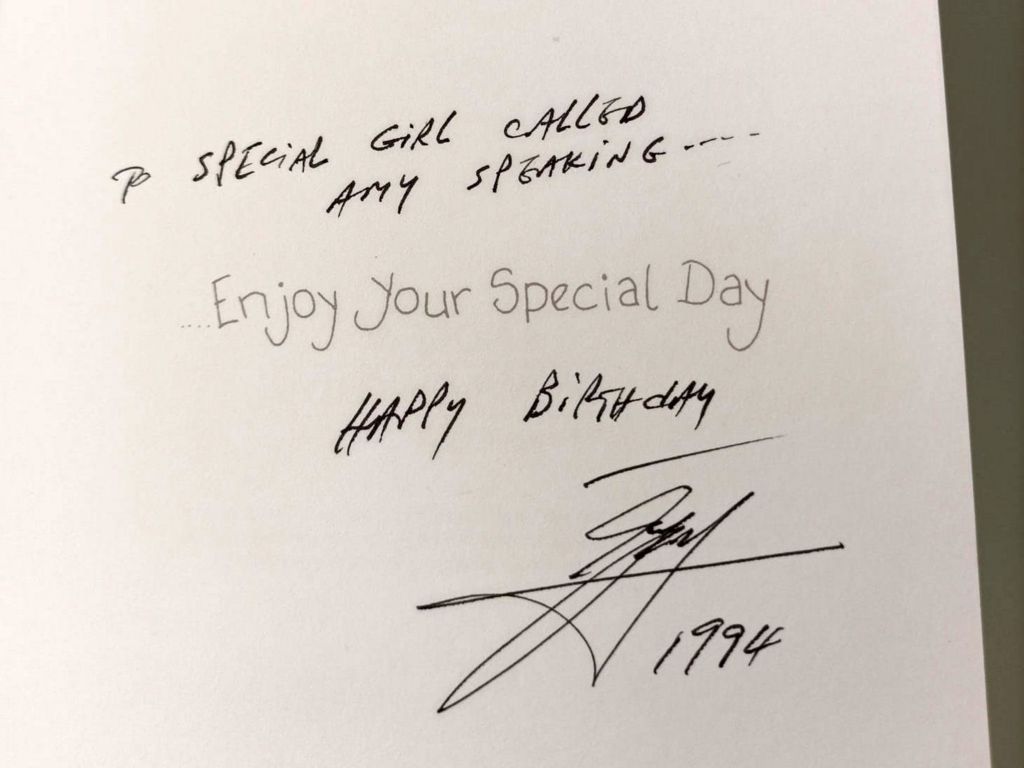 A close-up photo of the inside of a birthday card Amy says Ali sent her. 'To a special girl called Amy Speaking' is written in the card as well as 'happy birthday' and a signature with '1994' beneath