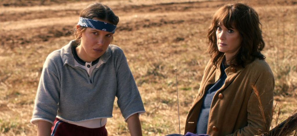 Millie Bobby Brown as Eleven and Winona Ryder as Joyce Byers in Stranger Things: Season 5