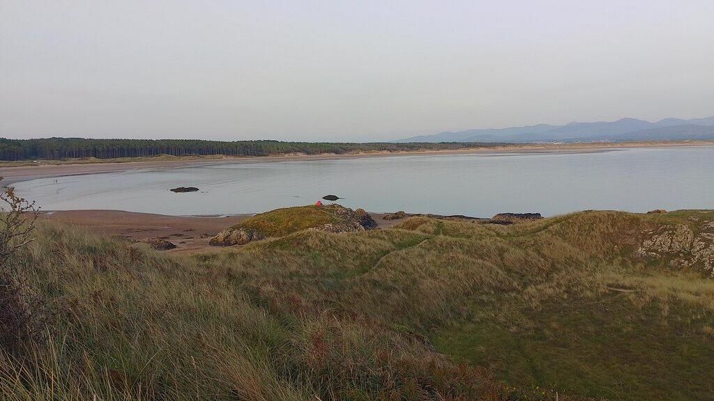 A secluded cove along the coastline at Llanddwyn beaches.