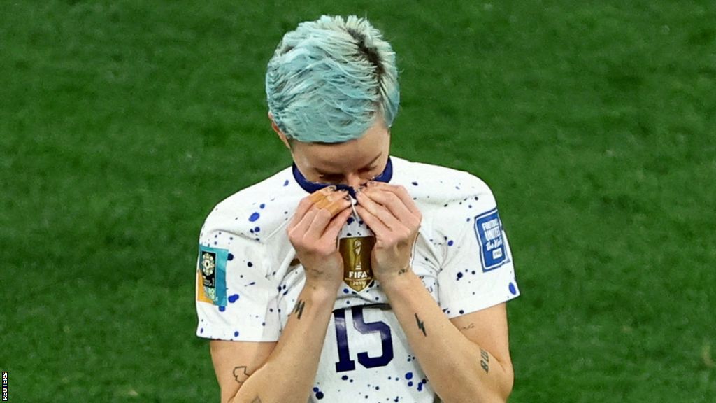Megan Rapinoe reacts with tears and pulls up her shirt to her face after the United States lose to Sweden at the Women's World Cup in 2023