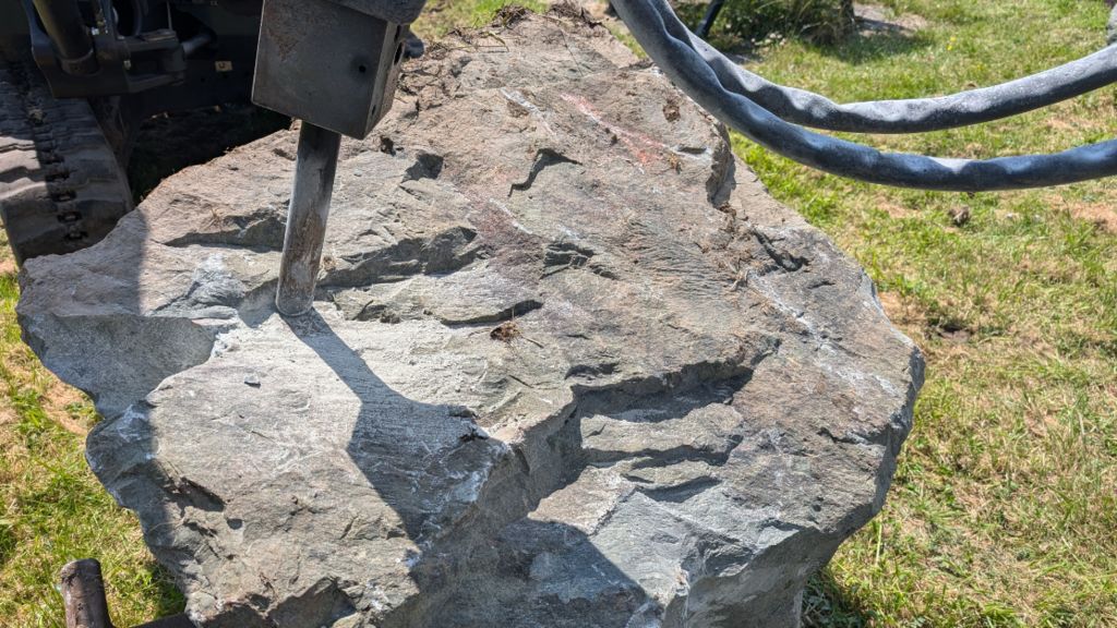 A boulder being broken up