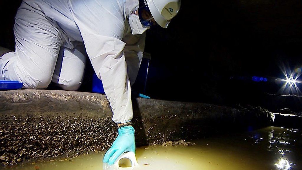 Man testing sewer water