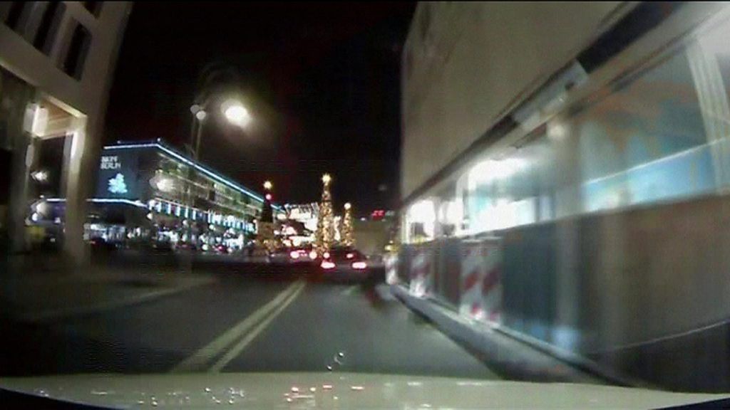Still shows footage from a taxi dashcam