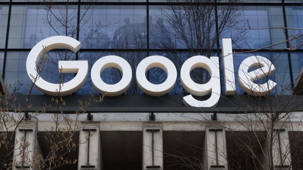 A Google corporate logo hangs above the entrance to their office at St. John's Terminal on March 31, 2024, in New York City.