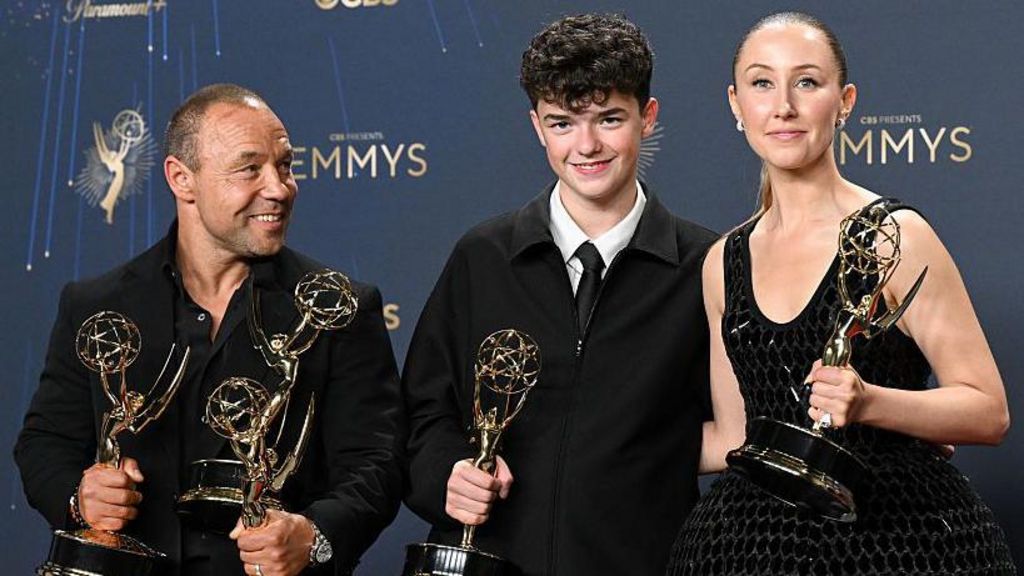 Stephen Graham, Owen Cooper and Erin Doherty holding awards and smiling at the Emmys