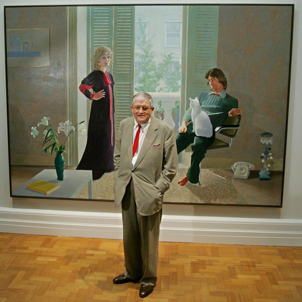 David Hockney poses in front of his painting entitled 'Mr and Mrs Clark and Percy' (1970) at the National Portrait Gallery in London, 11 October 2006
