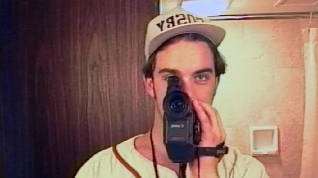 Robbie Williams films himself in a mirror using a camcorder during the first flush of Take That's fame