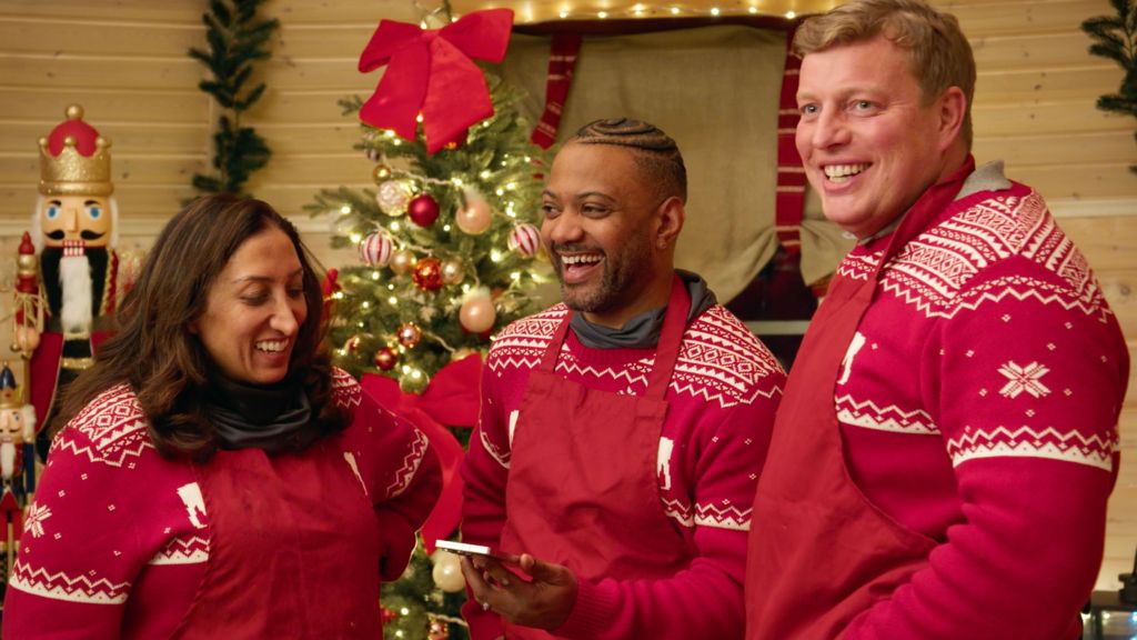 Shazia Mirza, JB Gill and Tom Skinner wearing Christmas jumpers on a festive special of the Apprentice
