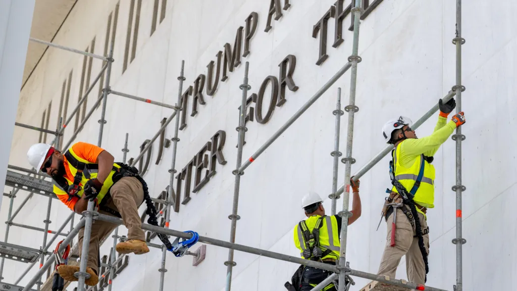 Workers preparing scaffolding in front of the Kennedy Center