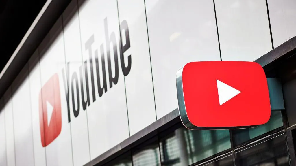 The YouTube brand on the side of a building, with a sign in the shape of the YouTube logo jutting out from the same building