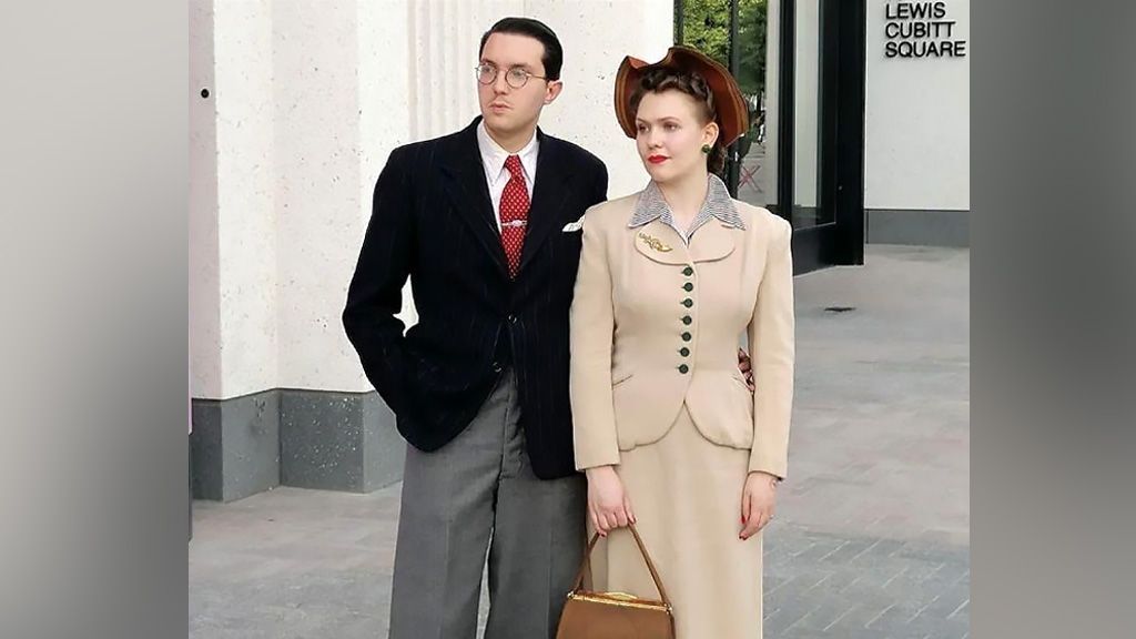 Greg Kirby and Liberty Avery dressed in 1940s clothing standing in the street