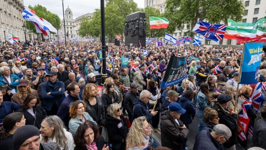 Protesters gather at a rally against antisemitism outside Downing Street in London on May 10 - a sea of people stand with placards and flags.