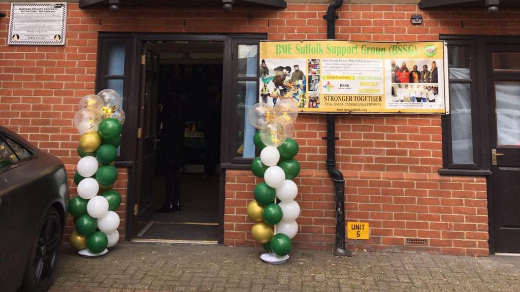 Outside of BSSG community hub in Ipswich where door is surrounded by balloons
