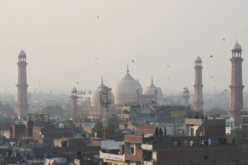 People fly kites from rooftops during the festive celebrations of the three-day kite-flying festival of Basant in Lahore, Pakistan, on February 6, 2026. (Photo by Murtaza Ali/NurPhoto via Getty Images)