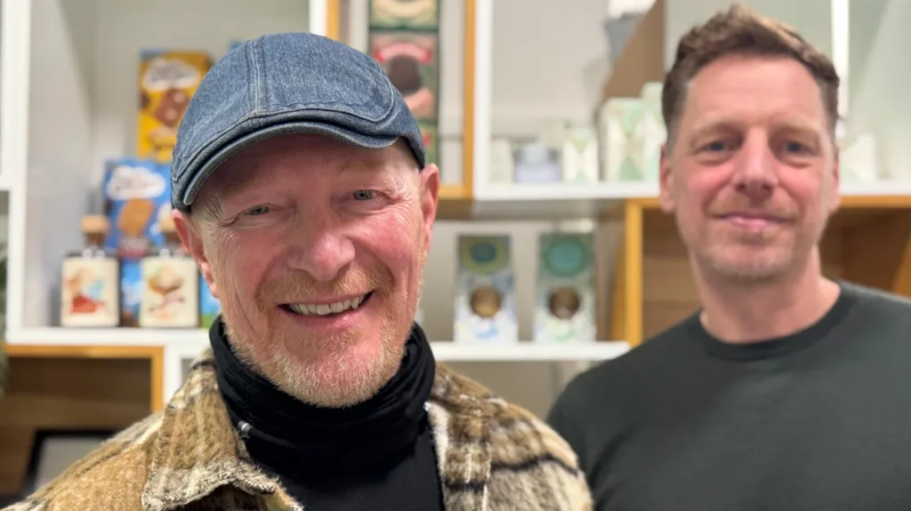 Gavin Arm, left, wearing a hat, and Bert de Wit smile at the camera