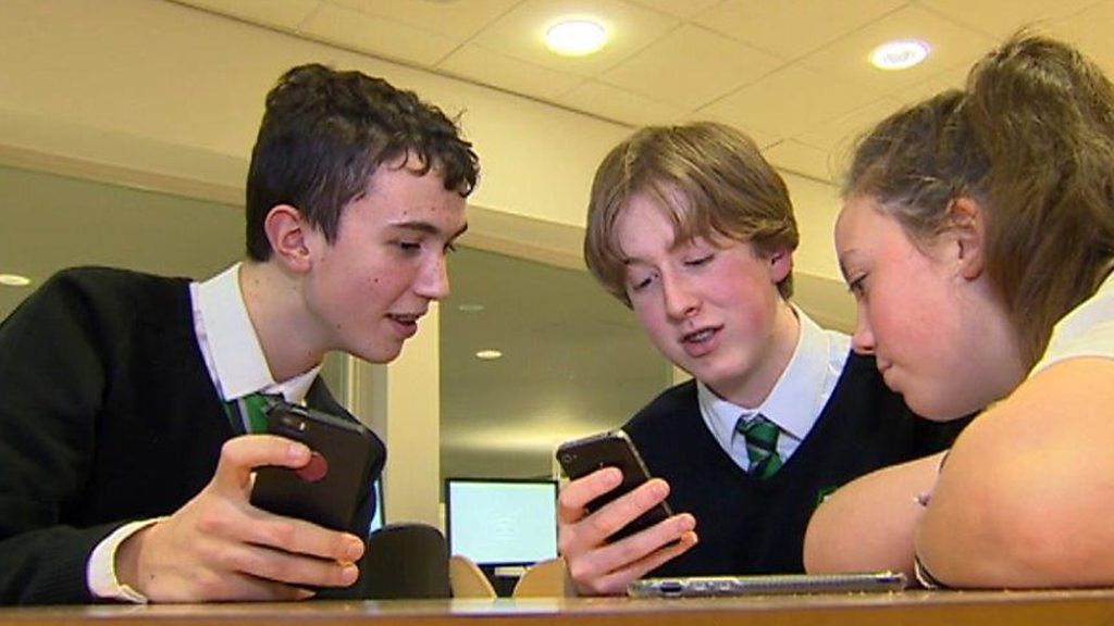 Teenagers on smart phones