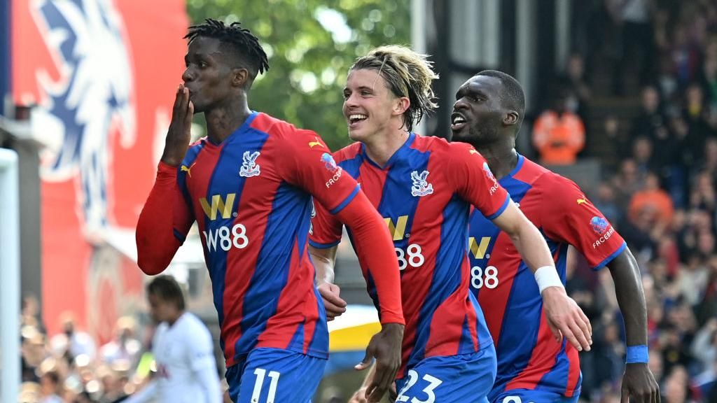 Wilfried Zaha celebrates after scoring a penalty against Spurs