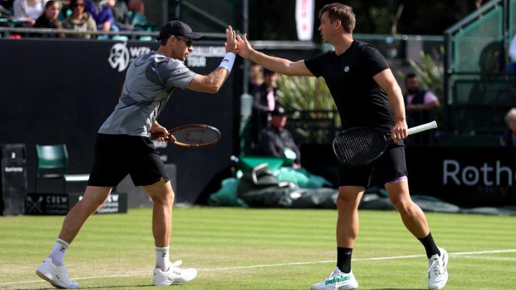 John Peers and Marcus Willis high-five