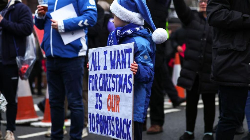 Young Everton fan protests points deduction