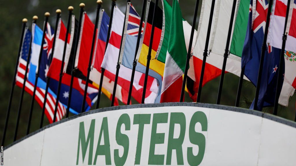 A general shot of a Masters leaderboard with national flags on top of it
