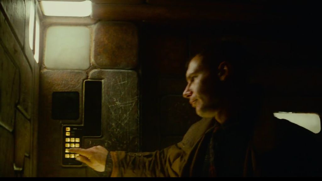 Deckard enters a lift in his home