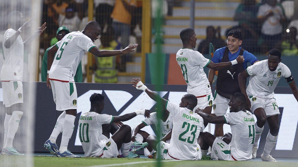 Mauritania players celebrate a goal against Algeria