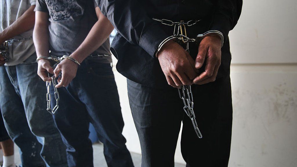 handcuffed prisoners