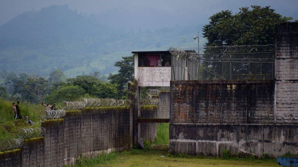 Security forces stand guard outside the premises of the Bellavista prison, in Santo Domingo de los Colorados, some 80 km (50 miles) from Quito, on May 10, 2022