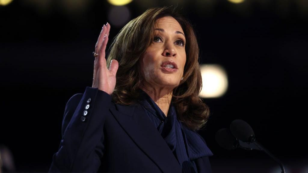 Kamala Harris stands at a lectern as she gives a speech at the 2024 Democratic National Convention in Chicago