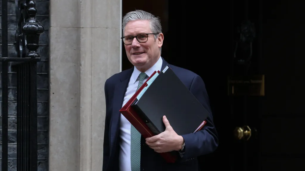 Keir Starmer outside Downing Street holding a folder