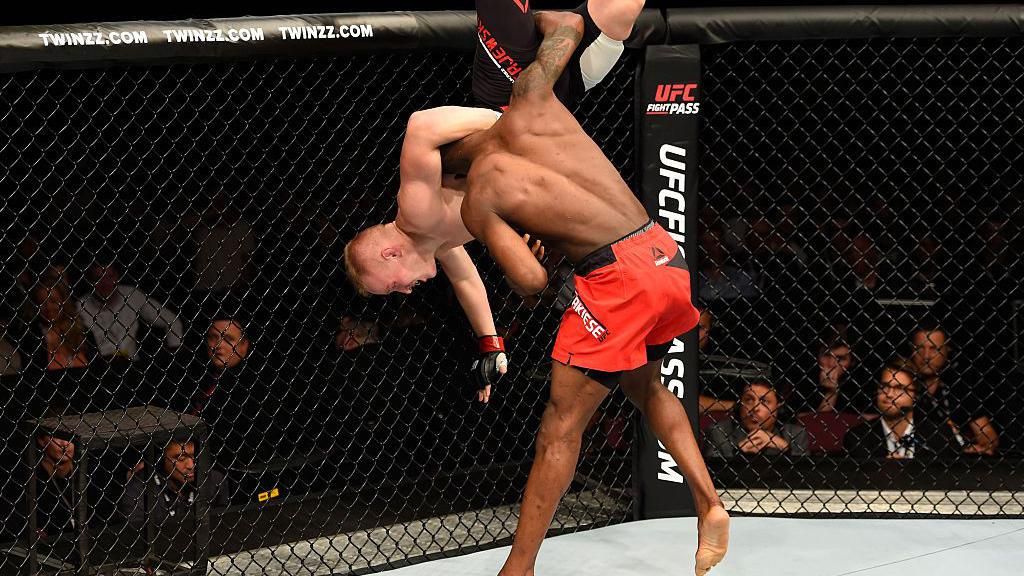 Marc Diakiese throws his opponent Lukasz Sajewski