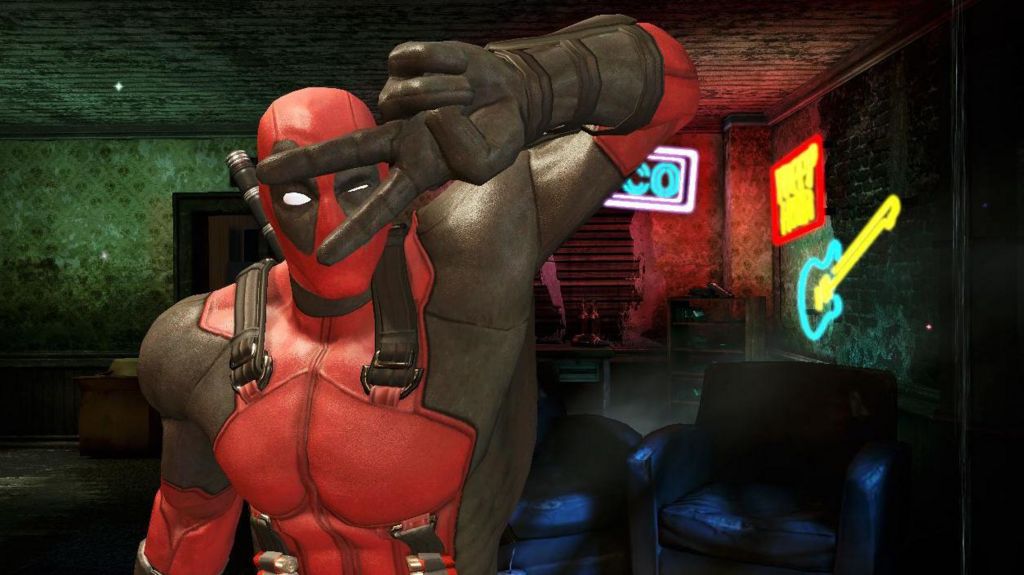 A screenshot of Deadpool from the 2013 computer game showing the peace sign with his fingers.  He is a superhero dressed in a red suit with black over the eyes and gloves.