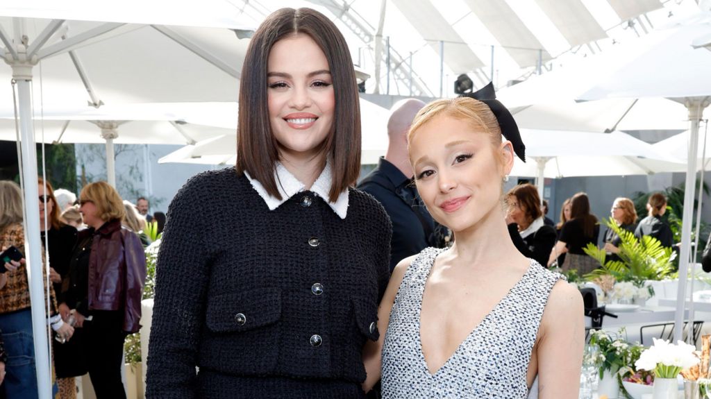  Selena Gomez, wearing CHANEL, and Ariana Grande, wearing CHANEL, attend the Academy Women's Luncheon presented by CHANEL at the Academy Museum Of Motion Pictures on December 10, 2024 in Los Angeles, California.