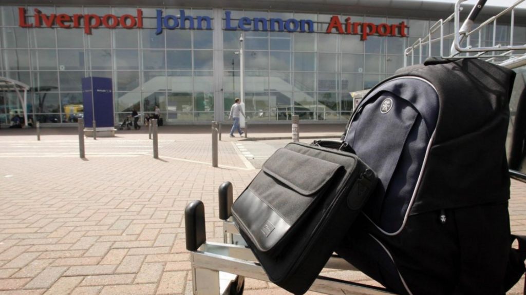 A passenger's luggage on a trolley outside the airport in Liverpool