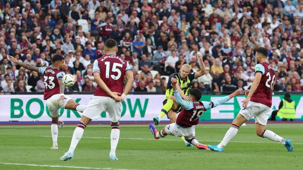 Erling Haaland takes a shot against West Ham