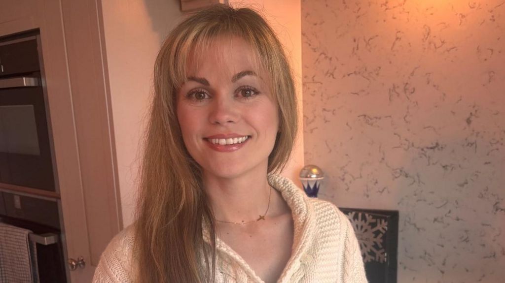 Kayleigh Taylor, a blonde-haired woman who is smiling at the camera.