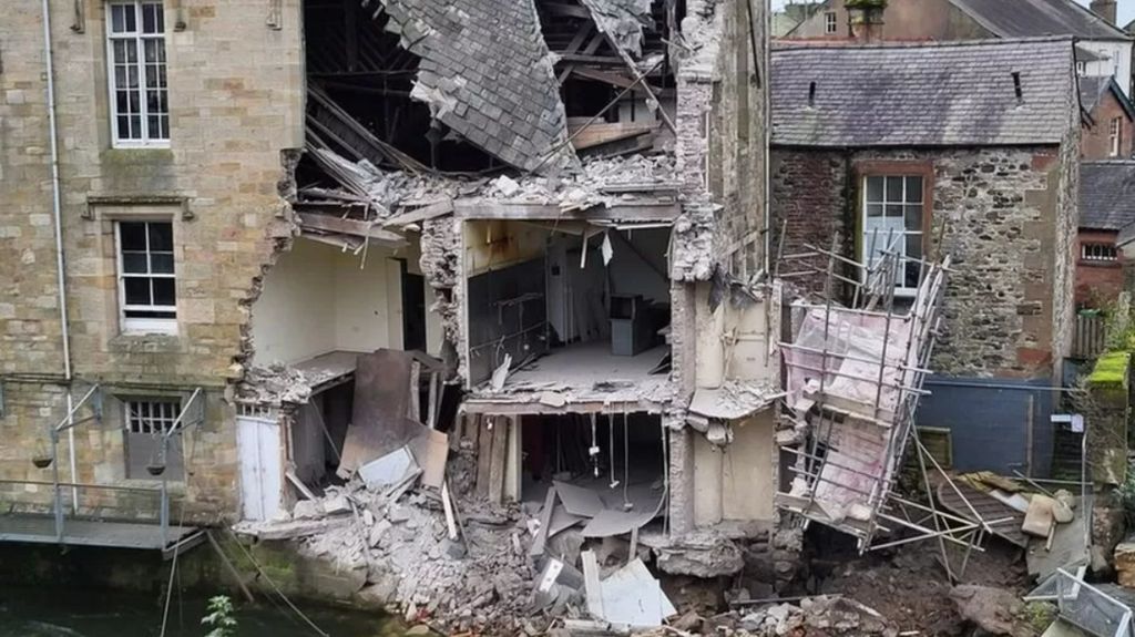 Rear of the partially collapsed building next to the River Cocker