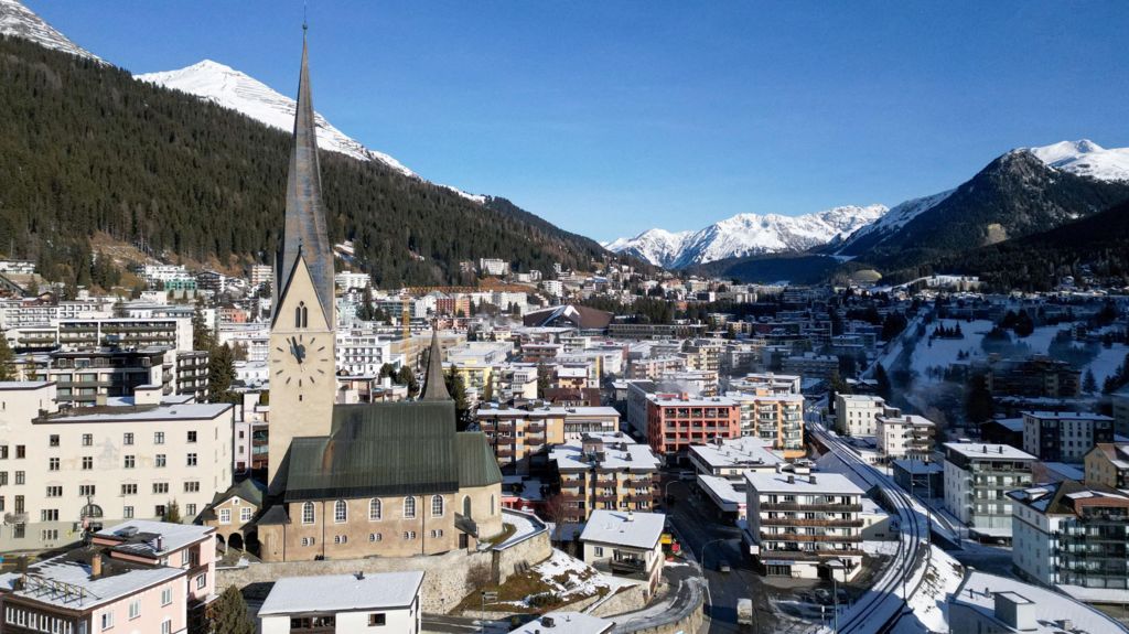 A view of St Johann church and the town of Davos ahead of the annual meeting of the World Economic Forum. There is a light covering of snow across the town and mountains can be seen in the background