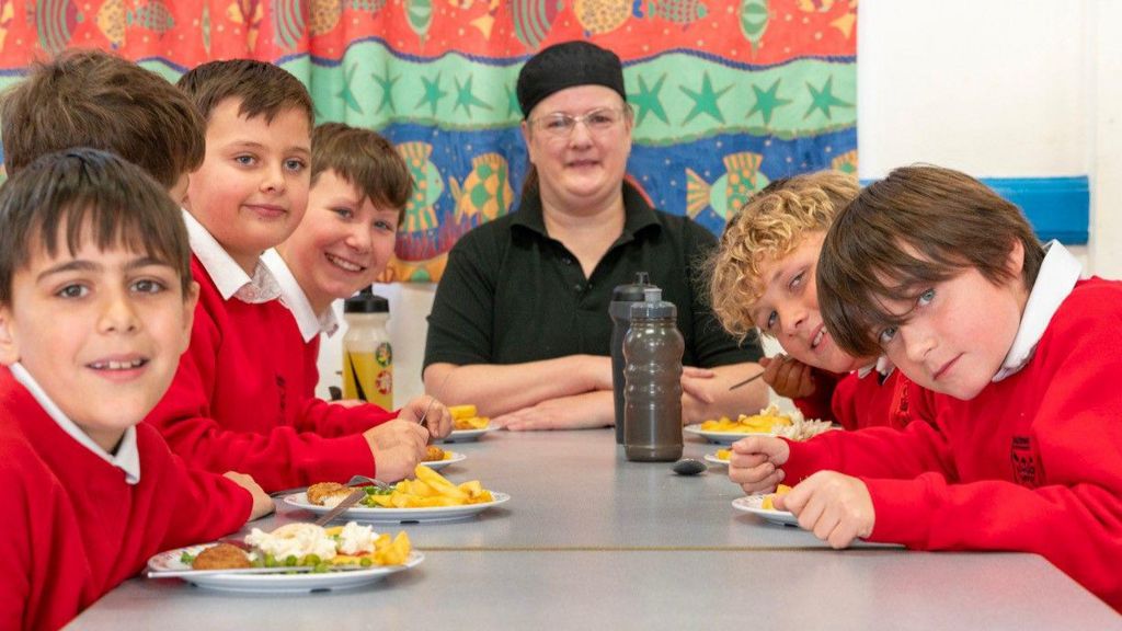 A chef with pupils of Southwold Primary School