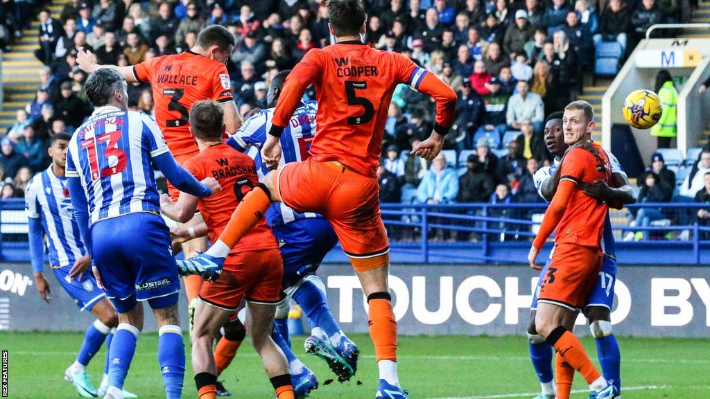 Murray Wallace of Millwall (3) scores his side's first goal of the match at Sheffield Wednesday