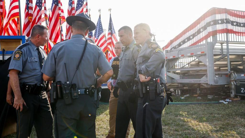 Law enforcement agents stand near the stage of a campaign rally for Republican presidential candidate former President Donald Trump on July 13, 2024 in Butler, Pennsylvania. 