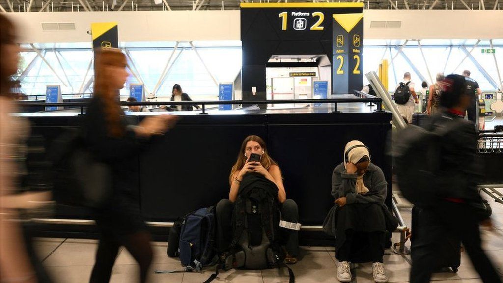 Passengers waiting at Gatwick Airport