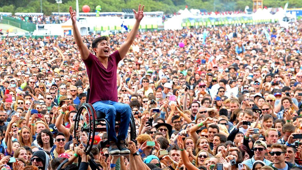 A wheelchair users crowd-surfs at California's Outside Lands festival