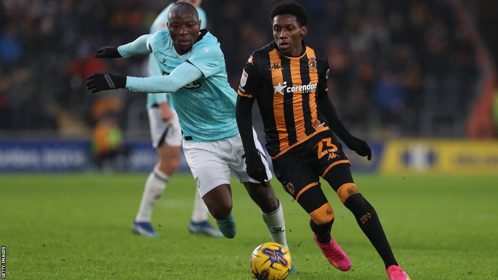 Jaden Philogene of Hull City (right) and Edo Kayembe of Watford compete for the ball