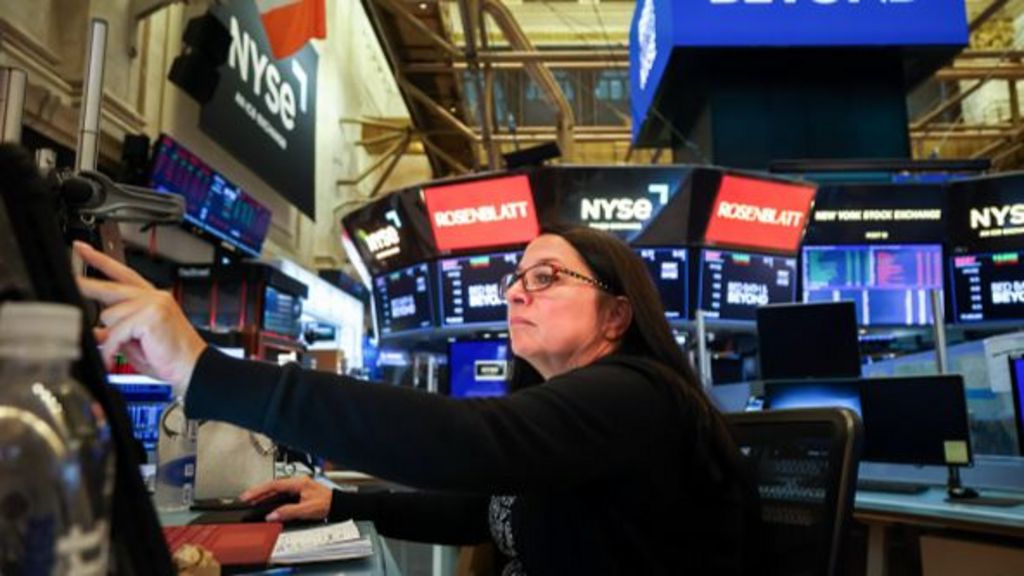 A trader works on the floor at the New York Stock Exchange.